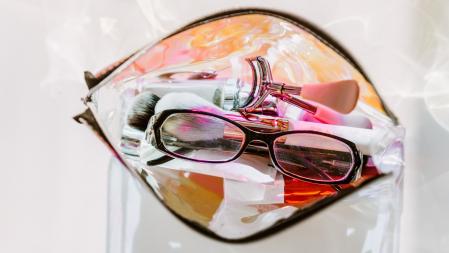 top view cosmetic make-up bag with beauty products