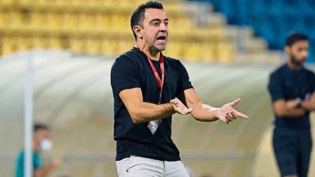 Qatari football club al-Sadd SC's Spanish coach Xavi Hernandez reacts during Qatar Stars League match between al-Sadd SC and al-Duhail SC, at Thani Bin Jassim Stadium (Al-Gharafah Stadium) in Qatar's capital Doha on November 3, 2021. (Photo by KARIM JAAFAR / AFP)