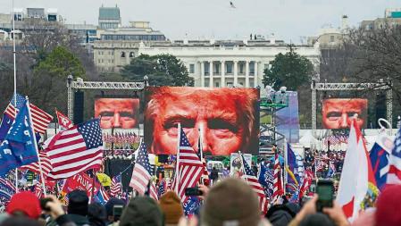 FILE - In this Jan. 6, 2021, file photo, Trump supporters participate in a rally in Washington. Far-right social media users for weeks openly hinted in widely shared posts that chaos would erupt at the U.S. Capitol while Congress convened to certify the election results. (AP Photo/John Minchillo, File)