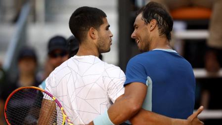 Tennis - ATP Masters 1000 - Madrid Open - Caja Magica, Madrid, Spain - May 6, 2022 Spain's Carlos Alcaraz Garfia with Spain's Rafael Nadal after their quarter final match REUTERS/Juan Medina
