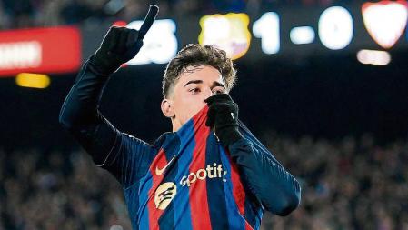 Barcelona's Spanish midfielder Gavi celebrates after scoring his team's second goal during the Spanish league football match between FC Barcelona and Sevilla FC at the Camp Nou stadium in Barcelona, on February 5, 2023. (Photo by Josep LAGO / AFP)