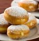 Sweet komemade krapfen pastry so called bomboloni, in Italy, (food -dessert) fullfilled wit a delicious cream.