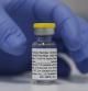 A vial of the Phase 3 Novavax coronavirus vaccine is seen ready for use in the trial at St. George's University hospital in London Wednesday, Oct. 7, 2020. Novavax Inc. said Thursday Jan. 28, 2021 that its COVID-19 vaccine appears 89% effective based on early findings from a British study and that it also seems to work — though not as well — against new mutated strains of the virus circulating in that country and South Africa. (AP Photo/Alastair Grant)