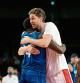 Spain's Pau Gasol Saez (R) and USA's Draymond Jamal Green greet at the end of the men's quarter-final basketball match between Spain and USA during the Tokyo 2020 Olympic Games at the Saitama Super Arena in Saitama on August 3, 2021. (Photo by Aris MESSINIS / AFP)