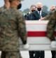 US President Joe Biden(C) attends the dignified transfer of the remains of fallen service members at Dover Air Force Base in Dover, Delaware, August, 29, 2021, after 13 members of the US military were killed in Afghanistan last week. - President Joe Biden prepared Sunday at a US military base to receive the remains of the 13 American service members killed in an attack in Kabul, a solemn ritual that comes amid fierce criticism of his handling of the Afghanistan crisis. Biden and his wife, Jill, both wearing black and with black face masks, first met far from the cameras with relatives of the dead in a special family center at Dover Air Force Base in Delaware.The base, on the US East Coast about two hours from Washington, is synonymous with the painful return of service members who have fallen in combat. (Photo by SAUL LOEB / AFP)