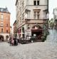 France, Lyon, people dining outside restaurant's in early evening