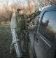 MYKOLAIV, UKRAINE - NOVEMBER 15: A member of the Ukrainian 63rd Separate Mechanised Brigade packs the remnants of a Russian rocket onto a truck up while dismantling a frontline position that the brigade had occupied for more than five months at the border of Mykolaiv and Kehrson Oblasts as they move to a new forward position in Kherson Oblast on November 15, 2022 in Mykolaiv, Ukraine. Russian forces retreated from Kherson City and region moving forces across to the west bank of the Dnipro river. Since the retreat Ukrainian forces have kept up pressure, moving equipment and soldiers forward creating a new frontline. (Photo by Chris McGrath/Getty Images)