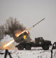 Ukrainian military fires from a multiple rocket launcher at Russian positions in the Kharkiv area, Ukraine, Saturday, Feb. 25, 2023. The Biden administration declared its Ukraine solidarity with fresh action as well as strong words on Friday, piling sweeping new sanctions on Moscow and approving a new $2 billion weapons package to re-arm Kyiv a year after Russia's invasion. (AP Photo/Vadim Ghirda)