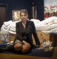LONDON, ENGLAND - JUNE 27: British artist Tracy Emin's sits in front of her 1998 piece 'My Bed' on display at Christie's on June 27, 2014 in London, England. This iconic work from the YBA moment is being offered at auction for the first time and is estimated to sell for between 800,000 - 1.2 million GBP. (Photo by Rob Stothard/Getty Images)