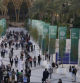 People walk through the COP28 U.N. Climate Summit, Monday, Dec. 4, 2023, in Dubai, United Arab Emirates. (AP Photo/Peter Dejong)
