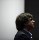 Former regional Catalan President Carles Puigdemont looks up during a joint news conference with current Catalan President Quim Torra following a meeting with their pro-independence Catalan Junts Per Catalunya party co-members in Brussels, Wednesday, Sept. 5, 2018. (AP Photo/Francisco Seco)