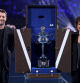 MELBOURNE, AUSTRALIA - JANUARY 27: The Daphne Akhurst Memorial Cup arrives in the Louis Vuitton trophy trunk, as Joel Edgerton and Evonne Goolagong Cawley reveal the trophy prior to the Women's Singles Final match between Qinwen Zheng of China and Aryna Sabalenka during the 2024 Australian Open at Melbourne Park on January 27, 2024 in Melbourne, Australia. (Photo by Julian Finney/Getty Images)