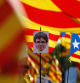 A protester holds a portrait of former Catalan President Carles Puigdemont during a demonstration to ask for the Parliament inclusion of the 3 Catalan elected MEP's Puigdemont, Oriol Junqueras and Toni Comin, in front of the European Parliament in Strasbourg, France, July 2, 2019. REUTERS/Vincent Kessler