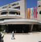 A man walks outside the municipality building in the West Bank city of Ramallah on May 24, 2024, adorned with flags of Spain, Ireland and Norway. Ireland, Norway and Spain said they would formally recognise the State of Palestine on May 28, drawing praises from Palestinian leaders as well as many countries in the Arab and Muslim world, and fury from Israel. (Photo by AHMAD GHARABLI / AFP)