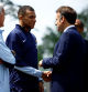 French President Emmanuel Macron shakes hands with French player Kylian Mbappe, next to Didier Deschamps, coach of French national football team, as he arrives for a lunch at their training camp ahead of the UEFA Euro 2024, in Clairefontaine-en-Yvelines, France, June 3, 2024. REUTERS/Sarah Meyssonnier/Pool