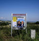 This photograph shows campaign posters displayed on an electoral board on the road side ahead the upcoming snap parliamentary elections on June 30 and July 7, in Pelussin near Lyon, central eastern France, on June 19, 2024. (Photo by JEAN-PHILIPPE KSIAZEK / AFP)