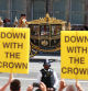 LONDON, ENGLAND - JULY 17: King Charles III and Queen Camilla are driven to Parliament in a state carriage as Republic, an anti monarchy group, protest along the procession's route, near to the Houses of Parliament, on July 17, 2024 in London, England. King Charles III delivers the King's Speech setting out the new Labour government's policies and proposed legislation for the coming parliamentary session. (Photo by Peter Nicholls/Getty Images)