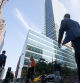 Office workers walk near the Goldman Sachs Group Inc. headquarters in New York, U.S., on Thursday, July 22, 2021. After a year of Zoom meetings and awkward virtual happy hours, New York's youngest aspiring financiers have returned to the offices of the city's investment banks, where they're making the most of the in-person mentoring and networking they've lacked during the pandemic. Photographer: Michael Nagle/Bloomberg