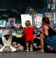 People look at pictures of hostages kidnapped during the deadly October 7 attack on Israel by Hamas, amid the ongoing conflict in Gaza between Israel and Hamas, in Tel Aviv, Israel October 5, 2024. REUTERS/Gonzalo Fuentes