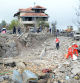 TOPSHOT - Paramedics with the Lebanese Red Cross unearth a body from the rubble at the site of an Israeli airstrike that targeted the northern Lebanese village of Aito on October 14, 2024. The Lebanese Red Cross said at least 18 people died in a strike on north Lebanon on October 14, with the health ministry and official media reporting an Israeli raid on the Christian-majority area far from Hezbollah strongholds. (Photo by Fathi AL-MASRI / AFP)