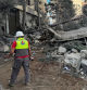A civil defence member of the Islamic Health Authority walks at a site damaged in an Israeli strike in Nabatieh, amid the ongoing hostilities between Hezbollah and Israeli forces, southern Lebanon October 16, 2024. REUTERS/Ali Hankir