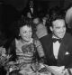 22nd September 1940: French singer Edith Piaf and French boxer Marcel Cerdan smile while sitting at a dining table at the Versailles nightclub, New York City. (Photo by Hulton Archive/Getty Images)