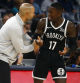 Oct 30, 2024; Memphis, Tennessee, USA; Brooklyn Nets head coach Jordi Fernandez talks with guard Dennis Schroder (17) during the second half against the Memphis Grizzlies at FedExForum. Mandatory Credit: Petre Thomas-Imagn Images