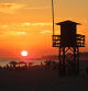 El ocaso de los vigilantes de la playa en Rota.