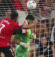 Mallorca's Vedat Muriqi hits Barcelona's goalkeeper Joan García, for which he was sent off, during the La Liga soccer match between Mallorca and Barcelona in Mallorca, Spain, Saturday, Aug. 16, 2025. (AP Photo/Joan Mateu Parra)