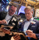 Traders Edward Curran, left, and Robert Charmak work on the floor of the New York Stock Exchange, Wednesday, Sept. 17, 2025. (AP Photo/Richard Drew)