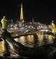 Imagen de la Torre Eiffel y el Sena de noche