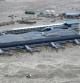 El aeropuerto de la ciudad de Sendai en la región de Miyagi se encuentra rodeado por agua tras el tsunami que ha arrasado el noreste japonés