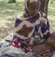 Una mujer del sur de Somalia tiene en sus brazos a un niño que sufre de malnutrición en el campo de refugiados de Mogadiscio, Somalia