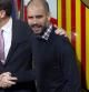 Sandro Rosell y Josep Guardiola estrechándose la mano
