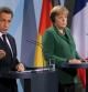 El presidente francés Nicolas Sarkozy y la canciller alemana Angela Merkel tras la reunión mantenida este domingo en Berlín