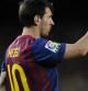 Leo Messi celebra uno de sus goles ante el Racing de Santander