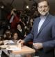 El presidente del PP y candidato a la presidencia del Gobierno, Mariano Rajoy, ejerce su derecho al voto en el colegio Bernadette de Madrid, en los comicios generales