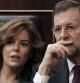 El presidente del Gobierno, Mariano Rajoy, y la vicepresidenta, Soraya Saénz de Santamaría, durante el debate de convalidación del Decreto Ley de Medidas urgentes en materia presupuestaria, tributaria y financiera para la corrección del déficit público que se celebra hoy en el Congreso.