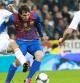Leo Messi itenta avanzar con el balón rodeado de contrarios del Real Madrid