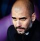 Pep Guardiola, sentado en el banquillo durante el Málaga-Barça