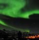Vista de la aurora boreal sobre la ciudad de Tromso (Noruega)