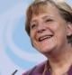 Angela Merkel sonríe en una rueda de prensa junto a Rajoy