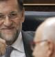El jefe del Ejecutivo, Mariano Rajoy, sonríe al paso del portavoz de CiU en el Congreso, Josep Antoni Duran Lleida, durante el pleno en el que hoy expone las conclusiones del último Consejo Europeo de Bruselas.