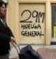 Pintada en Málaga anunciando la huelga general del 29M