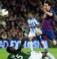 Messi supera al portero del Málaga Kameni