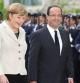 El presidente francés François Hollande es recibido por la canciller alemana Angela Merkel a su llegada a la Cancillería Federal