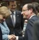 Merkel saluda a Hollande.