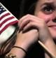 Una partidaria escucha al presidente de EE.UU. Barack Obama durante su discurso en la noche electoral del 6 de noviembre 2012 en Chicago, Illinois