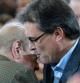 Artur Mas comenta con Jordi Pujol en un momento del mitin de la candidatura de CiU en Granollers