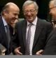 Guindos, Juncker y Rehn, en una reunión del Eurogrupo